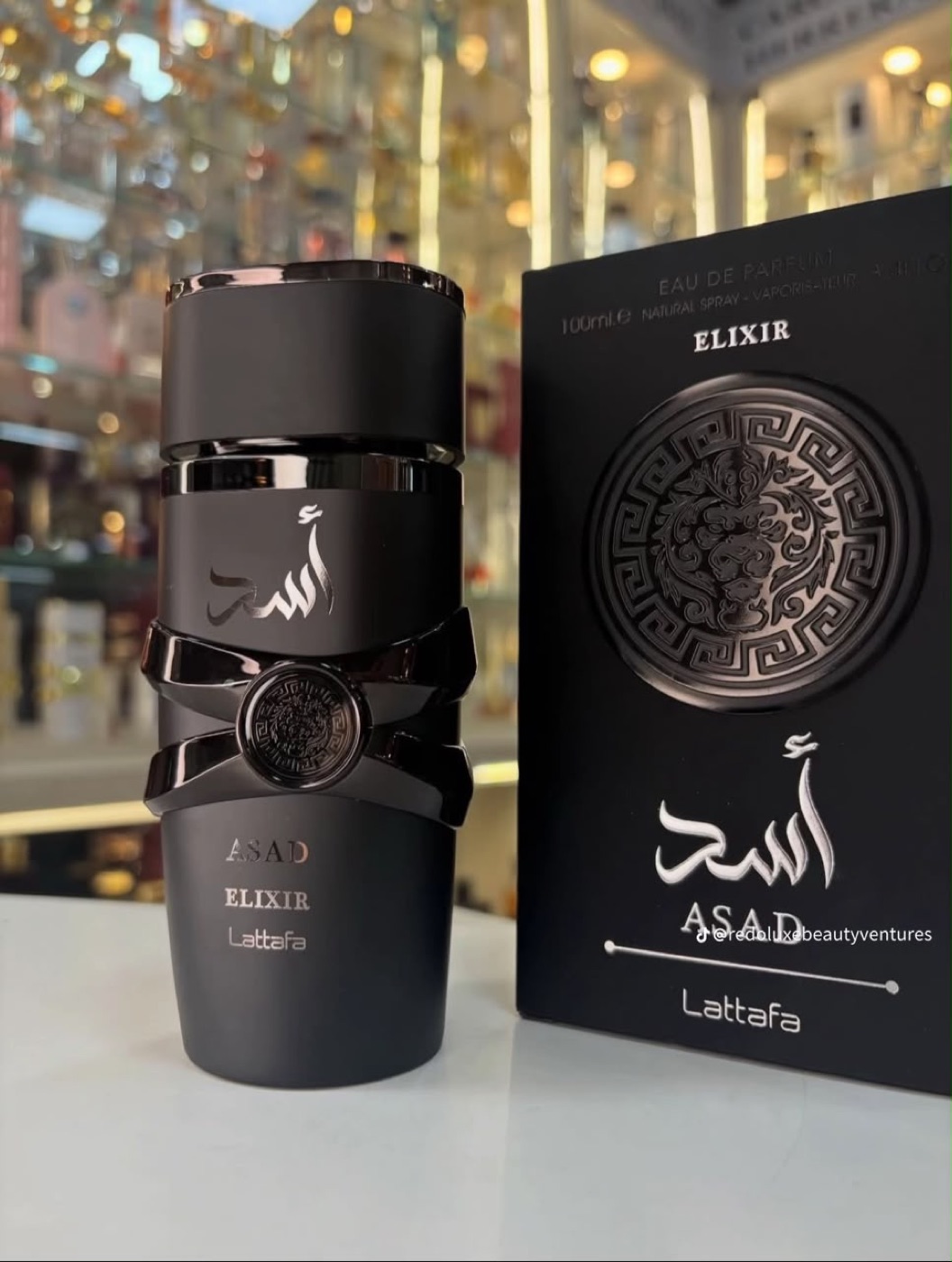 Oud perfume bottle and petals